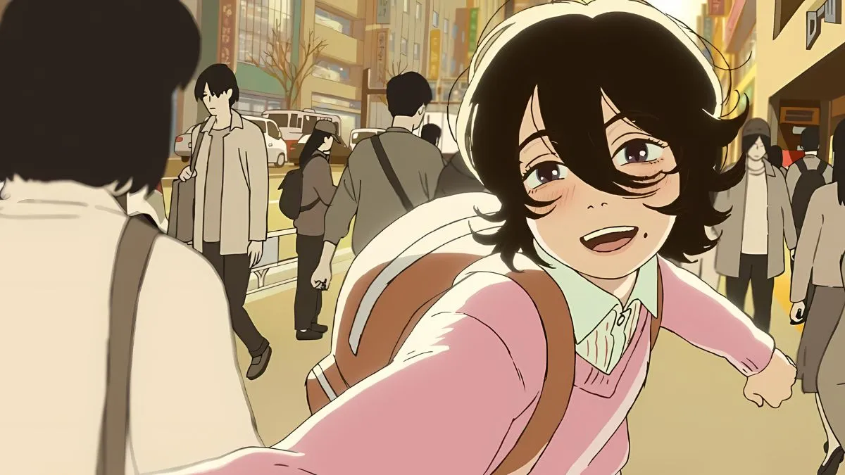 Hideo Kojima Gushes Over New Anime Film From 'Chainsaw Man' Creator Look-Back-anime-film-screencap-of-one-of-the-characters-running-and-smiling-through-a-crowded-city-street